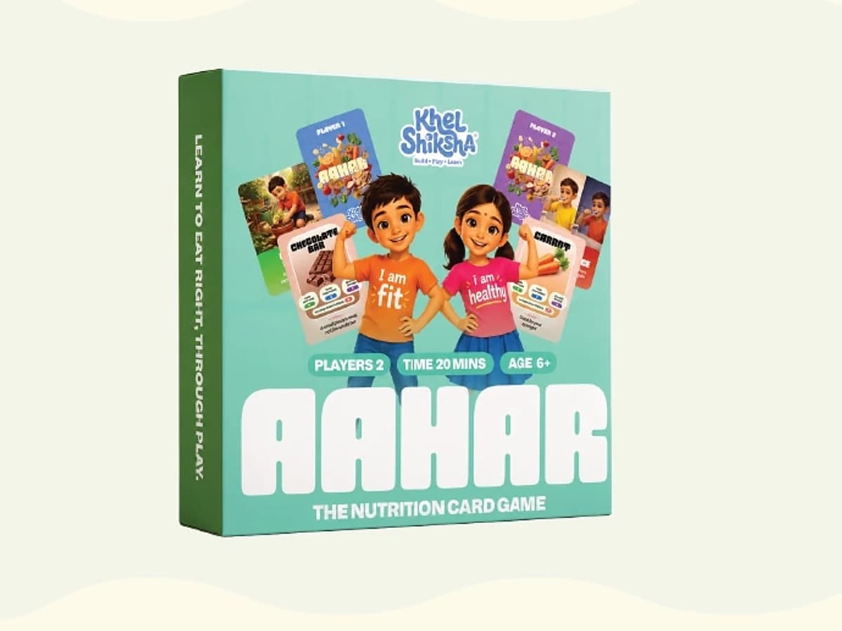 The Aahar retail box, green, showing two children holding fanned-out nutrition cards above the title "The Nutrition Card Game"