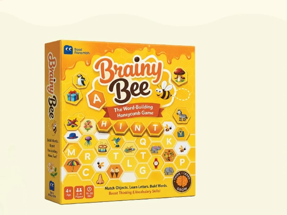The Brainy Bee retail box, yellow, with a honeycomb grid of letters and small illustrated objects around the title